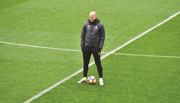 Real Madridu2019s French coach Zinedine Zidane takes part in a training session at Valdebebas training ground in Madrid yesterday.