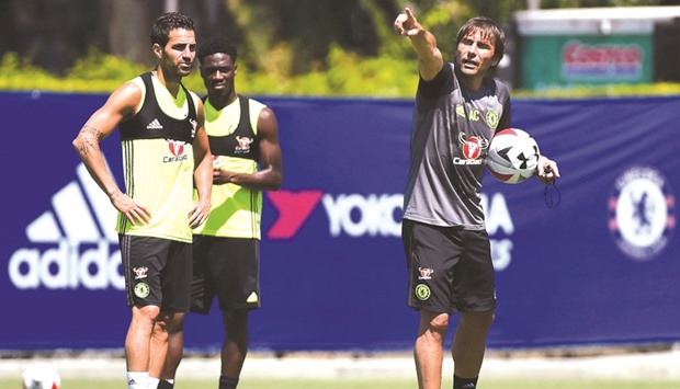 File picture of Chelsea coach Antonio Conte (R) gesturing during a training session.