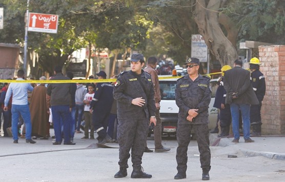 Special police officers stand guard at the scene of a bomb blast in Cairo yesterday.