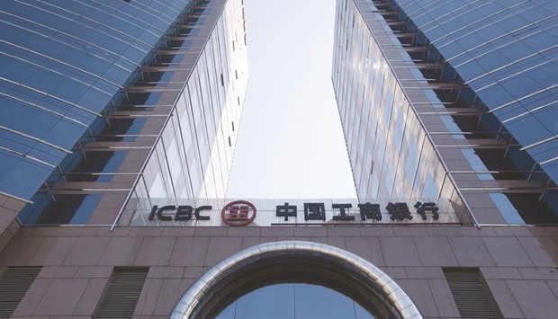 The company logo for the Industrial & Commercial Bank of China is seen outside a branch in Beijing. ICBC, the worldu2019s biggest lender by assets and at least three others are offering customers discounts when they sell foreign currency.
