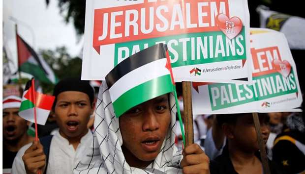 Protesters hold a rally outside the US embassy in Jakarta, Indonesia, to condemn the US decision to recognise Jerusalem as Israel's capital.