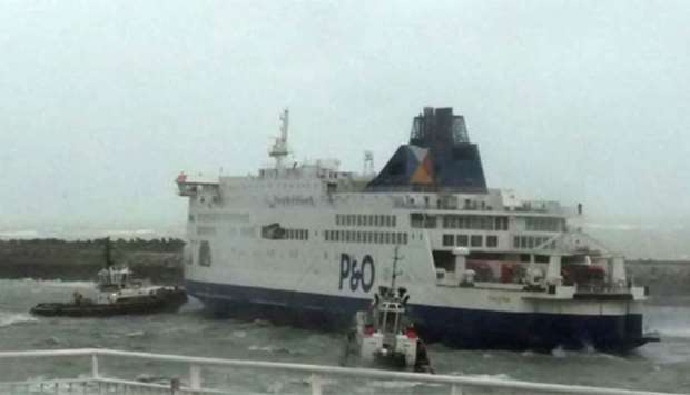 Tugboats manoeuvre the P&O ferry MS Pride of Kent which ran aground in Calais on Sunday.