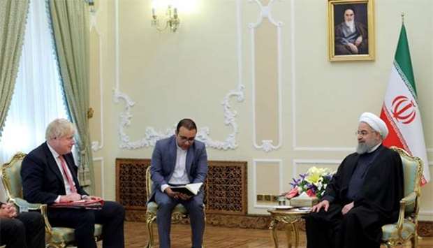 Britain's Foreign Secretary Boris Johnson meets with Iranian President Hassan Rouhani in Tehran on Sunday.