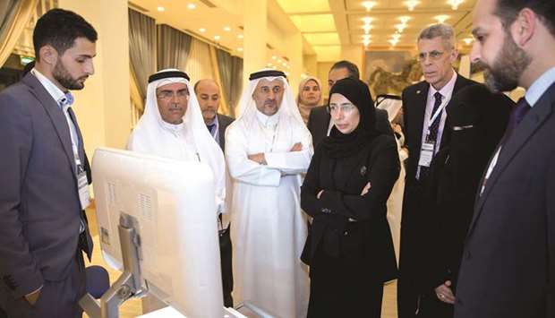   HE the Minister of Public Health Dr Hanan Mohamed al-Kuwari with other dignitaries and officials at the opening ceremony of the inaugural HIMSS Qatar Educational Conference and Health IT Exhibition.