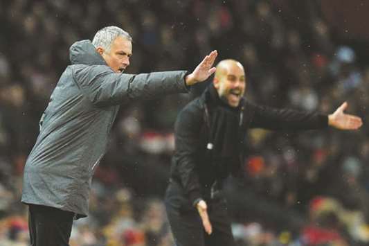 Manchester Unitedu2019s Portuguese manager Jose Mourinho (L) and Manchester Cityu2019s Spanish manager Pep Guardiola (R) gesture during their teamu2019s match in the EPL yesterday.