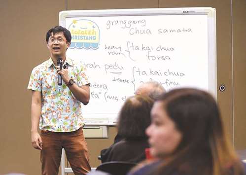 Kevin Martens Wong, 25-year-old linguist tutor, conducting Kristang language class at the national library board in Singapore.
