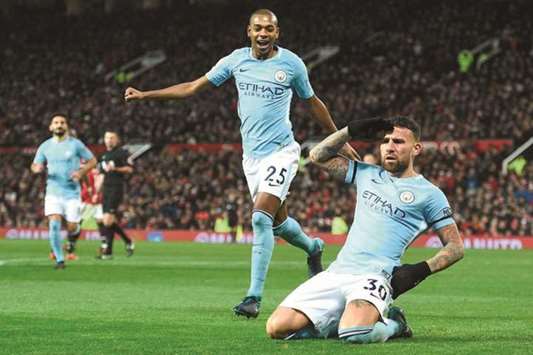 Manchester Cityu2019s Argentinian defender Nicolas Otamendi (R) celebrates scoring their second goal against Manchester United at Old Trafford in Manchester, north west England, yesterday.