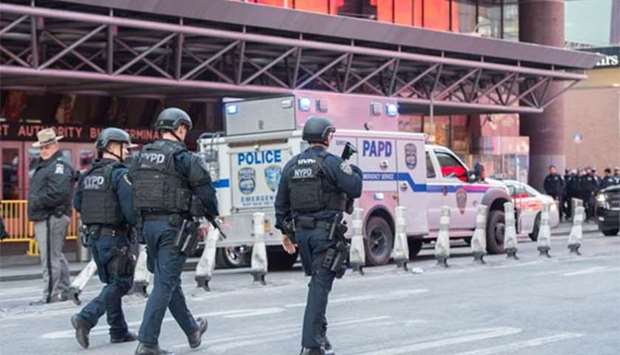 Police respond to a reported explosion at the Port Authority Bus Terminal in New York on Monday.