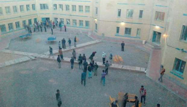 People are seen standing in the courtyard for safety after earthquake hit Kerman province