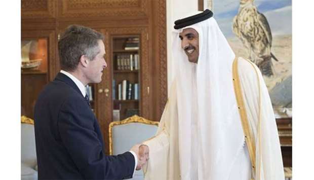 His Highness the Emir Sheikh Tamim bin Hamad al-Thani shakes hands with UK Defence Secretary Gavin Williamson in Doha on Monday. 