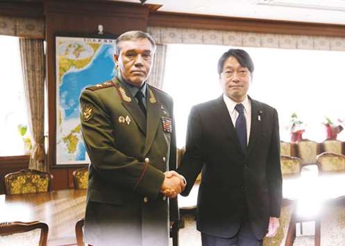 General Valery Gerasimov (left), Chief of the General Staff of the Armed Forces of Russia, shakes hands with Japanu2019s Defence Minister Itsunori Onodera during their meeting at the Defence Ministry in Tokyo, Japan.