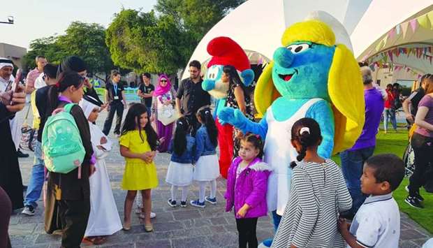 The Smurfs welcome families and children who spend their weekend at the festival. PICTURES: Joey Aguilar.