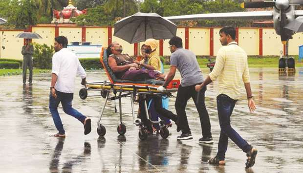 A stranded fisherman rescued by naval and air force helicopters arrives at the Thiruvananthpuram airport yesterday.