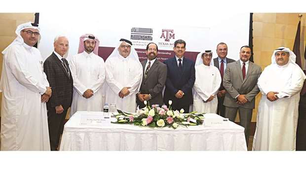 Ashghal president Saad bin Ahmed al-Muhannadi, Tamuq dean Dr Cesar Malave and other officials after the MoU signing.