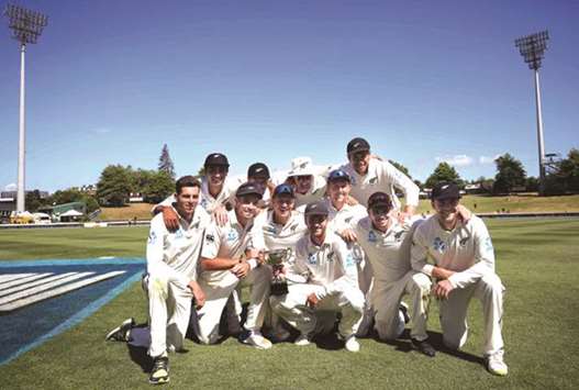 New Zealand players celebrate their Test series win after the second Test against the West Indies at Seddon Park in Hamilton yesterday. (AFP)