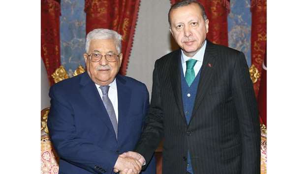Turkish President Tayyip Erdogan meets with Palestinian President Mahmoud Abbas in Istanbul, yesterday.
