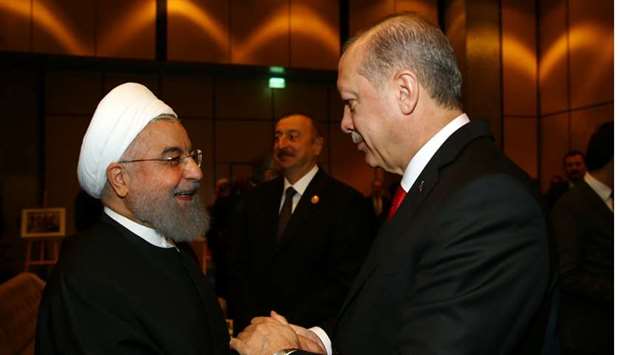 Turkish President Tayyip Erdogan meets with Iran's President Hassan Rouhani during an extraordinary meeting of the Organisation of Islamic Cooperation (OIC) in Istanbul.