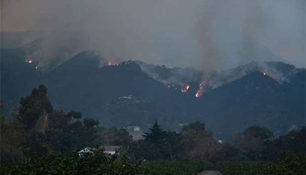 Fires burn across Romero Canyon hillside in Montecito, north of Santa Barbara, on Tuesday.