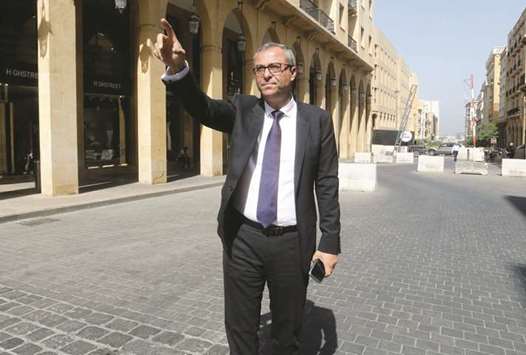 Oussama Kabbani, chief operating officer of Solidere International, gestures as he walks in downtown Beirut (file). Political tensions have put a security cordon around Solidereu2019s glittering central Beirut showcase and scared off investors. Low oil prices also weigh on a market long dependent on petrodollars from the Gulf.