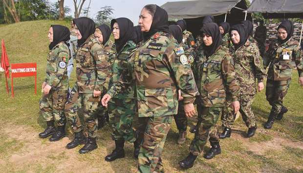 Afghan army cadets march during a training programme at the Officers Training Academy in Chennai.