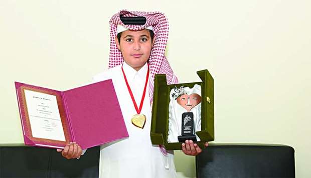 Abdulaziz al-Humaidi with his gold medal.rn