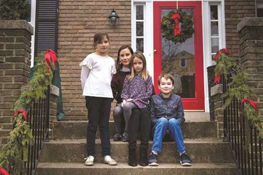 Tess Finnegan poses with her children in Washington, DC. The US economy is nearing full employment, with its jobless rate the lowest in almost 20 years, but women in the workforce donu2019t fully benefit. Due to the lack of widely available and affordable child care and pre-school programmes, as well as the lack of paid parental leave, many women fall out of the labour market when they have children.