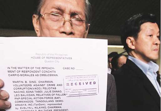 Eligio Mallari, president of Vanguard of the Philippine Constitution, shows a copy of the impeachment complaint filed against Ombudsman Conchita Carpio Morales.
