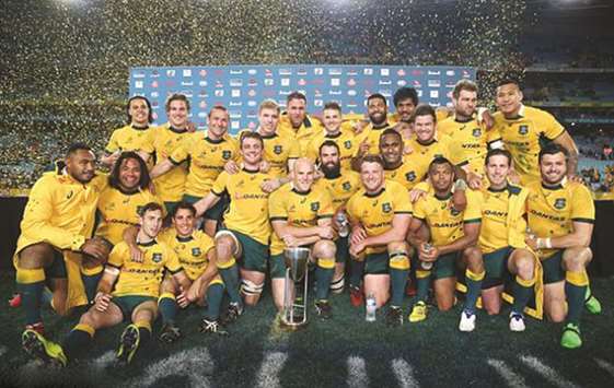 The Wallabies pose with the Rugby Championship trophy after beating New Zealand in Sydney on August 7, 2015.
