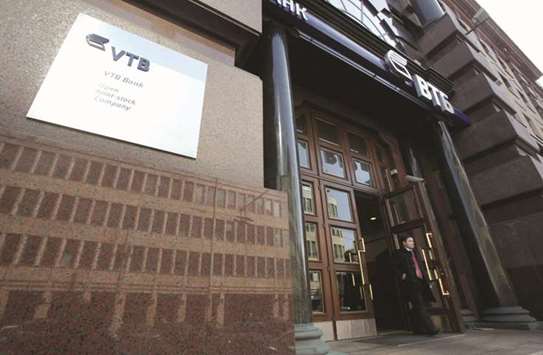 A customer leaves a branch of VTB bank in Moscow. VTB and Sberbank  experienced a sharp rise in higher-risk-weighted exposures during the three months to the end of September, data from their third-quarter accounts shows.