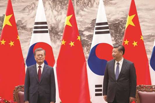 South Korean President Moon Jae-in and Chinese President Xi Jinping are seen during a signing ceremony at the Great Hall of the People in Beijing, China.