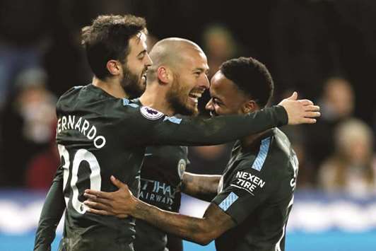Manchester Cityu2019s David Silva (centre) celebrates with Raheem Sterling (right) and Bernardo Silva after scoring their third goal against Swansea City during their EPL match. (Reuters)