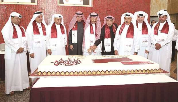 Sheikh Abdullah bin Ali bin Jabor al-Thani, Hussain Alfardan, Omar Hussain Alfardan and other Commercial Bank board members at the cake-cutting ceremony.