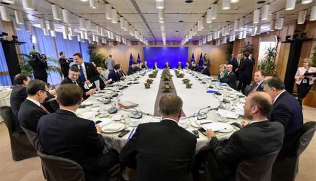 European leaders take part in a breakfast meeting on the second day of a European Union summit in Brussels on Friday.