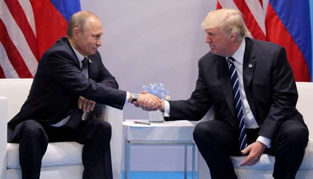 US President Donald Trump shakes hands with Russia's President Vladimir Putin during their bilateral meeting at the G20 summit in Hamburg, Germany, July 7, 2017.