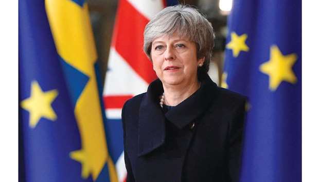 Prime Minister Theresa May arrives to attend the European Union summit in Brussels.