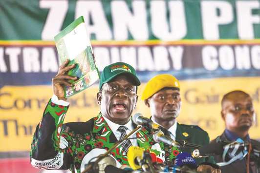 Zimbabweu2019s President Emmerson Mnangagwa speaks during the opening of the extraordinary conference of the ZANU-PF party.