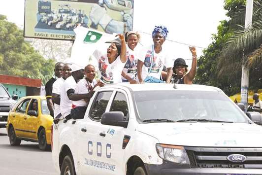Supporters of the Liberian Liberty Party (LP) who recently joined the Coalition for the Democratic Change of one of the leading candidates and former football player George Weah, parade in Monrovia.