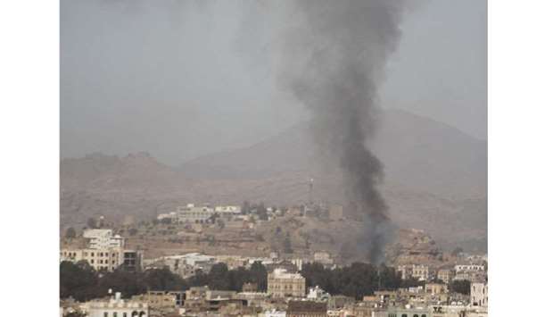 Smoke rises after an air strike in Sanaa, Yemen yesterday.
