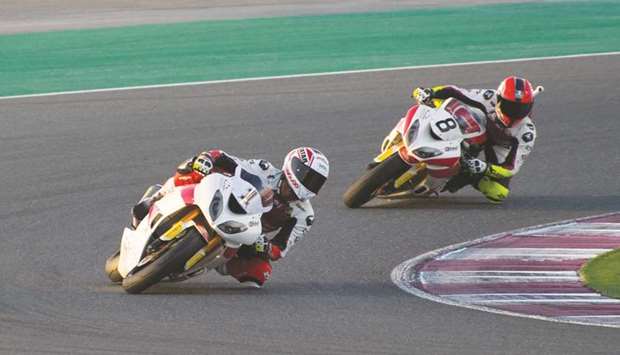 Saeed al-Sulaiti (left) and Abdullah al-Qubaisi in action during the free practice session for the opening round of the Qatar Superstock 600 at Losail International Circuit yesterday.