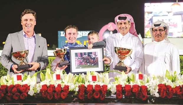 Qatar Racing and Equestrian Club (QREC) deputy chief steward Abdulla Rashid al-Kubaisi (right) with trainer Julian Smart (left), jockey Theo Bachelot (second from left) and Al Shahania Stud director Abdul Rahman al-Mansour after Bau2019sil won the Losail Cup at the QREC yesterday. PICTURES: Juhaim