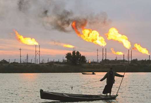 Flames emerge from flare stacks at the oil fields in Basra, Iraq (file). Iraq earlier this month announced plans to build a crude pipeline to fellow Opec member Iran.