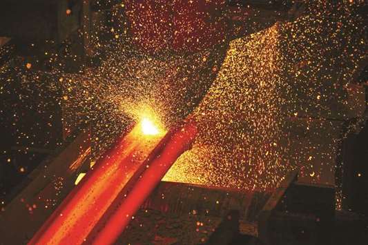 A furnace strikes sparks on a red hot steel beam inside the ArcelorMittal HighVeld Steel and Vanadium plant in eMalahleni, South Africa. India is banking on the Steel Authority of Indiau2019s partnership with ArcelorMittal to cut imports of high-grade auto steel, which mostly comes from Japan and South Korea.