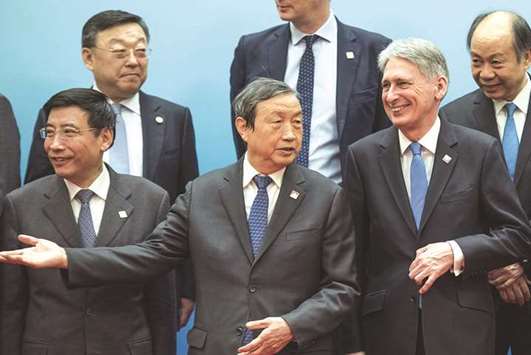 Britainu2019s Chancellor of the Exchequer Philip Hammond and Chinese Vice Premier Ma Kai attend the UK-China Economic Financial Dialogue at the Diaoyutai State Guesthouse in Beijing yesterday. Hammond said the two countries are also discussing a long-awaited London-Shanghai stock connect programme, as well as a possible scheme to connect their bond markets.