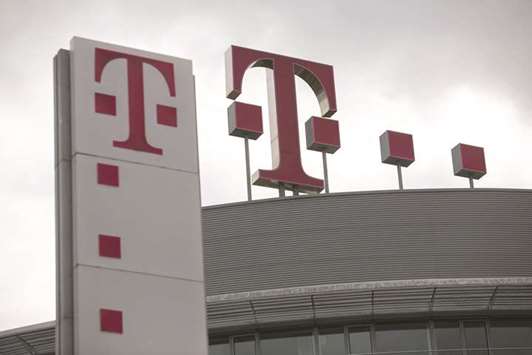 The T-Mobile logo sits on top of the Deutsche Telekom headquarters in Bonn, Germany. Deutsche Telekom will buy the Dutch business of Swedenu2019s Tele2 and combine it with its T-Mobile Nederland to give it more muscle to challenge rivals KPN and Ziggo.