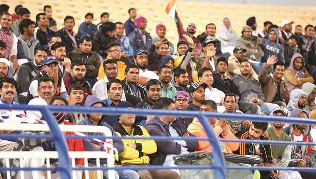 A section of the crowd watching the match at Asian Town Stadium.