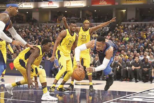In this December 13, 2017, picture, Oklahoma City Thunderu2019s Russell Westbrook (right) attempts a pass while guarded by Indiana Pacersu2019 Victor Oladipo (second from left) during their NBA game in Indianapolis, Indiana. (USA TODAY Sports)