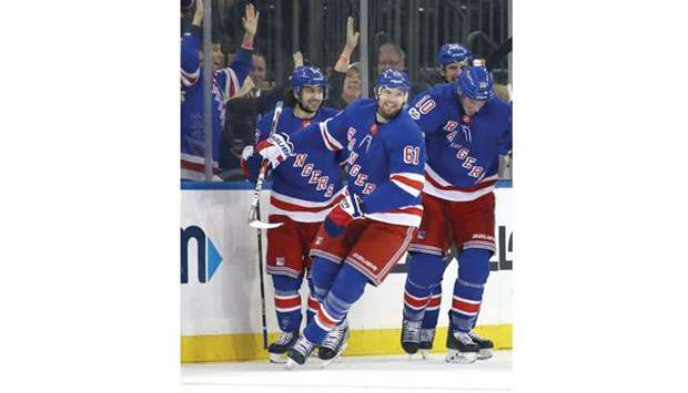 Rick Nash (centre) of the New York Rangers celebrates his game-winning goal during the NHL game against the Los Angeles Kings at Madison Square Garden in New York City on Friday. (AFP)