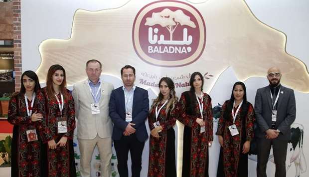 Baladna CEO John Joseph Dore (3rd from left) and his staff at their company's pavilion at Made in Qatar Exhibition yesterday. PICTURE: Jayaram