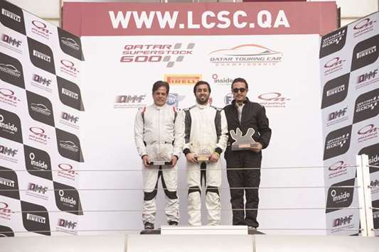 Abdulla al-Khelaifi (centre), the winner of both races in the second round of the QTCC yesterday.