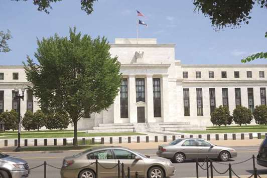 The US Federal Reserve building in Washington, DC.  The Fed plans three rate hikes in 2018 as well as a $400bn reduction in the size of its balance sheet.